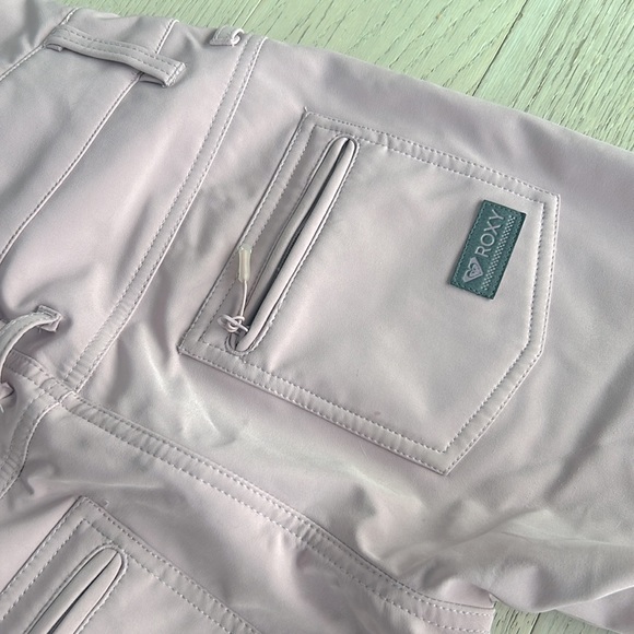 Roxy Women's Summit Bib Pants in pink. - Picture 6 of 9